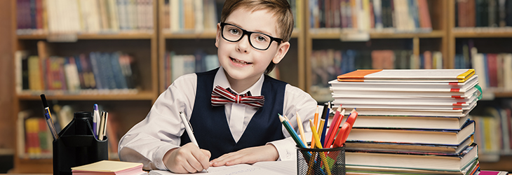 School Kid Studying in Library, Child Writing Paper Copy Book in Classroom with Shelves